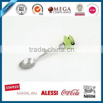 Green colored tea cup handle cake spoon