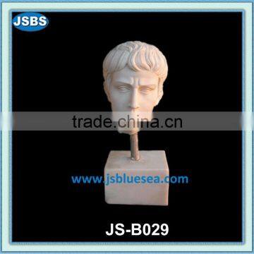 carved stone human bust statue