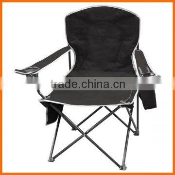 Camping chair with cooler bag on the armrest