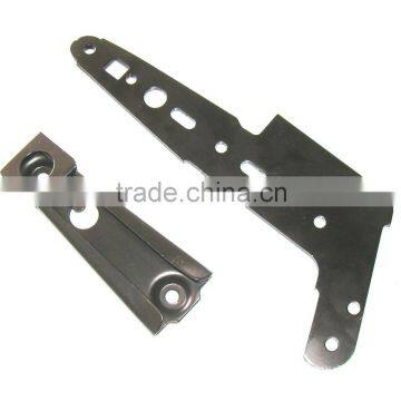 Recliner mechanism metal stampings