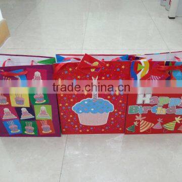 birthday paper gift bag with riboon handle