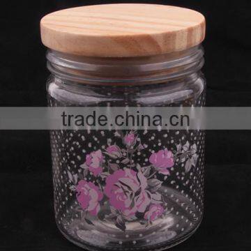 glass jar with decal and wooden lid
