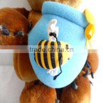 Eating honey plush bear toys holding honey pot