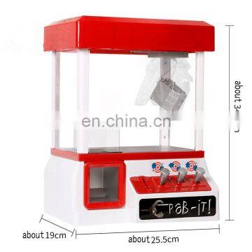 Children loved indoor coin operated claw crane machine game with music