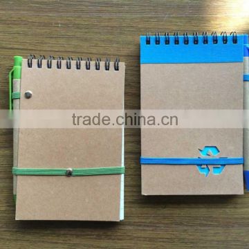 Promotion cheap and popular 140x90mm recycle notebook with pen attached