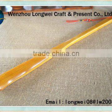 long wooden shoe horn with rope handle