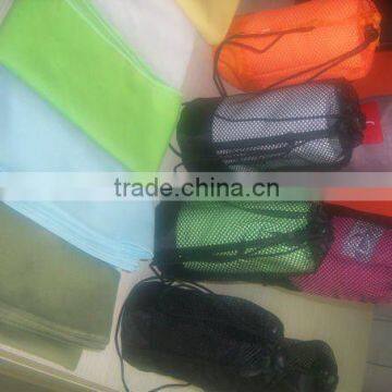 Compact sports towel with net bag