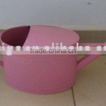 garden pink metal watering can