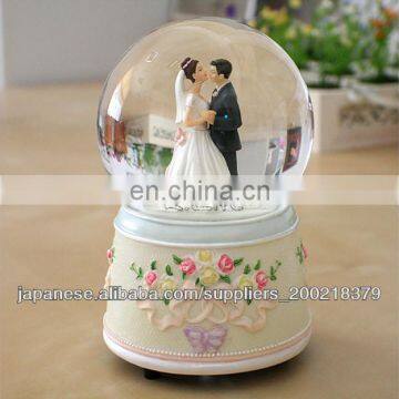 the ormate wedding couple water globe