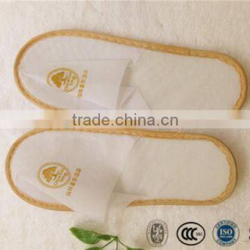 Non-woven material CHEAP hotel slipper with water ripple EVA sole