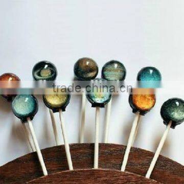 Handcrafted 3d lollipop with planet pattern design