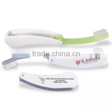 Fold Away Toothbrush - ergonomically designed handle features a rubber grip for easy brushing with medium nylon bristles