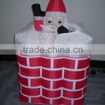 Holiday inflatable floating santa claus in chimney