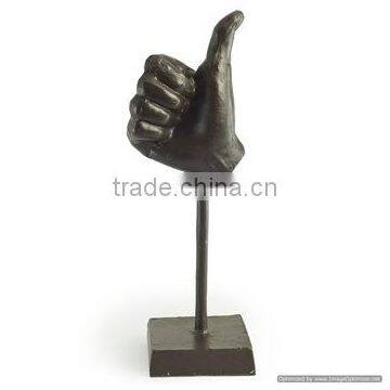 black human hand thums up sculpture