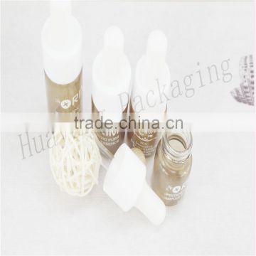 light amber glass bottle with white cap white glass bottle