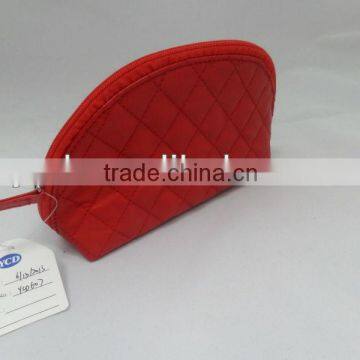 red pvc cosmetic bag with quilted stitching