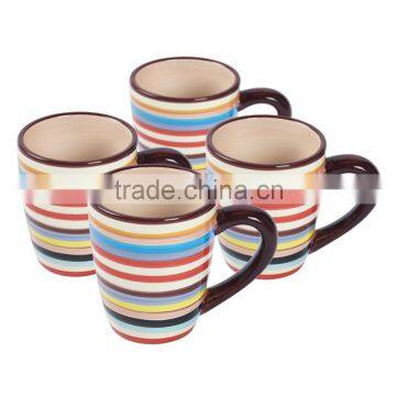 plain stoneware ceramic mug with four design items and lunch box