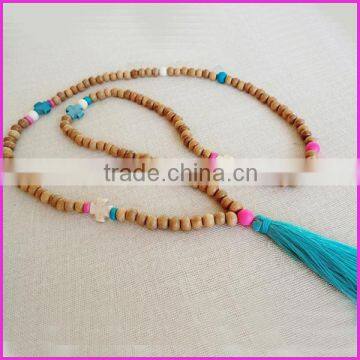 NE2167 Fashion wooden bead tassel necklace with cross and a silky teal tassel