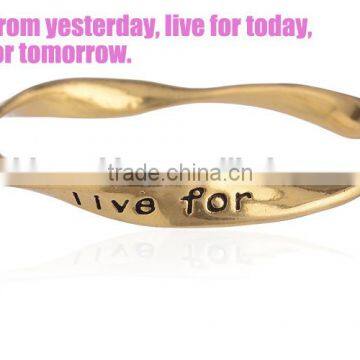 High end gold plating saying logo engraved bangle unique twist metal bangle for 2016 promotional items