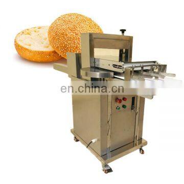 Safety fast cutting two half of burger bread isolated machine