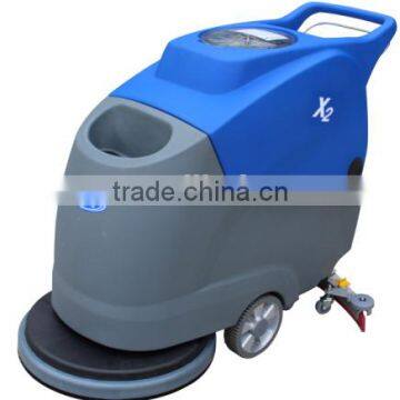 Hand held rotating ceramic tile floor scrubber