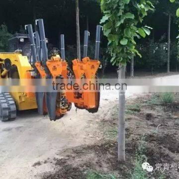 Four blade tree spade for crawler-type skid loader