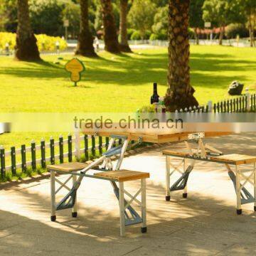 Wooden folding picnic table and chairs