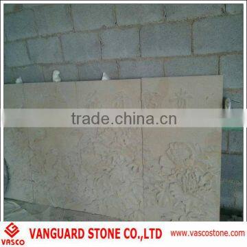 Carved stone wall decoration