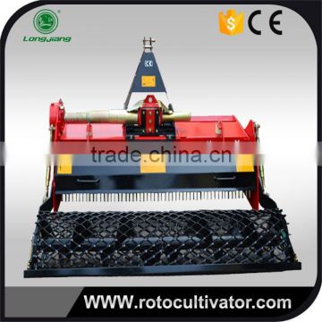 Rotary tiller with stone picker