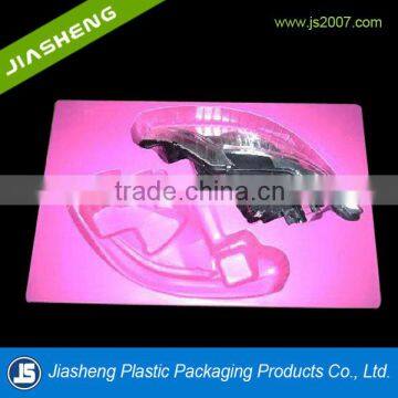 red plastic clamshell toy packaging for gun