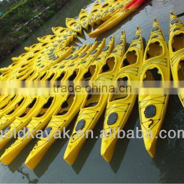 two person sit in ocean kayak