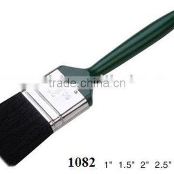 green-lacquered plastic hand and pure bristle painting brush