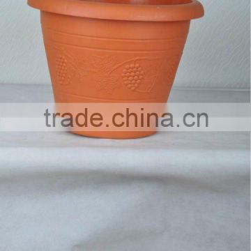 plastic watering can,terra cotta pots,pots planters