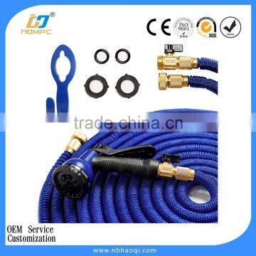 Watering expandable spring garden hose with spray nozzle