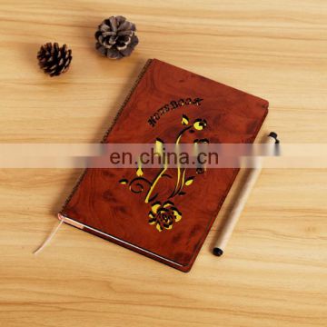 Cardboard cover notebook with pen attached