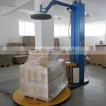 Plate pressed type wrapping machine with stretch film packing