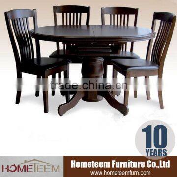 Round dining table in custom made wood furniture