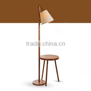 Natural wooden floor lamp with a chair for reading