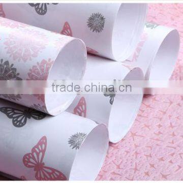 Ivory plastic gift wrapping paper roll
