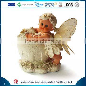 Cute small girl angel figurine with wings