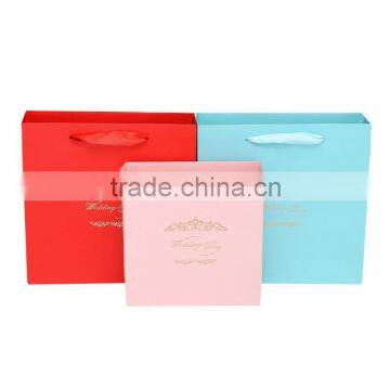 Wholesale cheap gift paper bag with ribbon handle