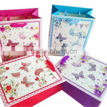 China supplier hot stamping paper gift bag with satin ribbon