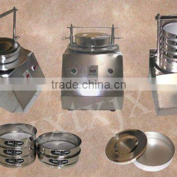 Vibrating sieving machine for powders