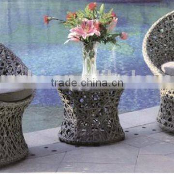 combined table and chair in round shape in white wicker color