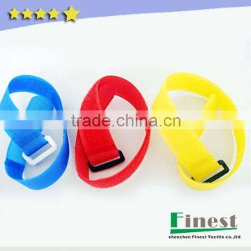 Hook and loop cable tie with custom color and logo