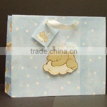 Small paper gift bag with ribbon handle