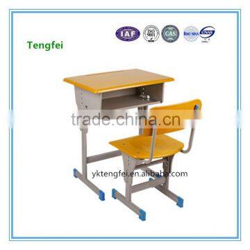 Adjustable school desk and chair for student studying in classroom