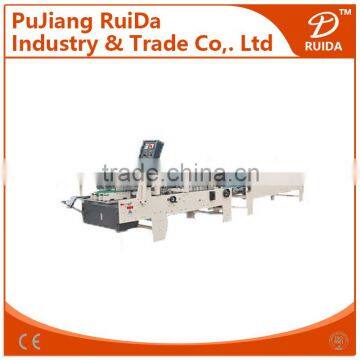 Automatic paperboard box pasting machine