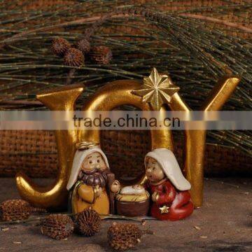 Nativity set religious art word "JOY"