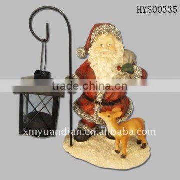 Santa holding candle holder with Christmas Elk Christmas decoration